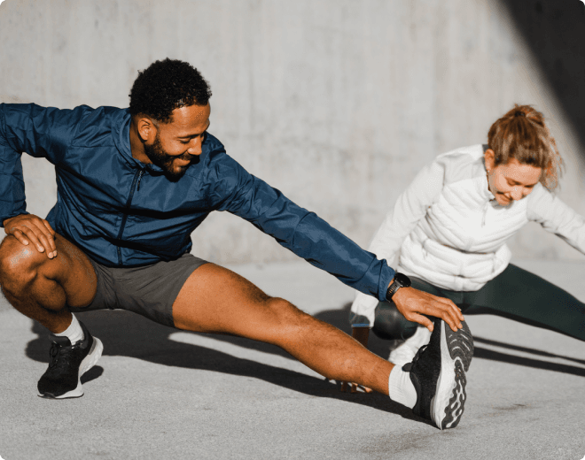 Image of Man and woman stretching